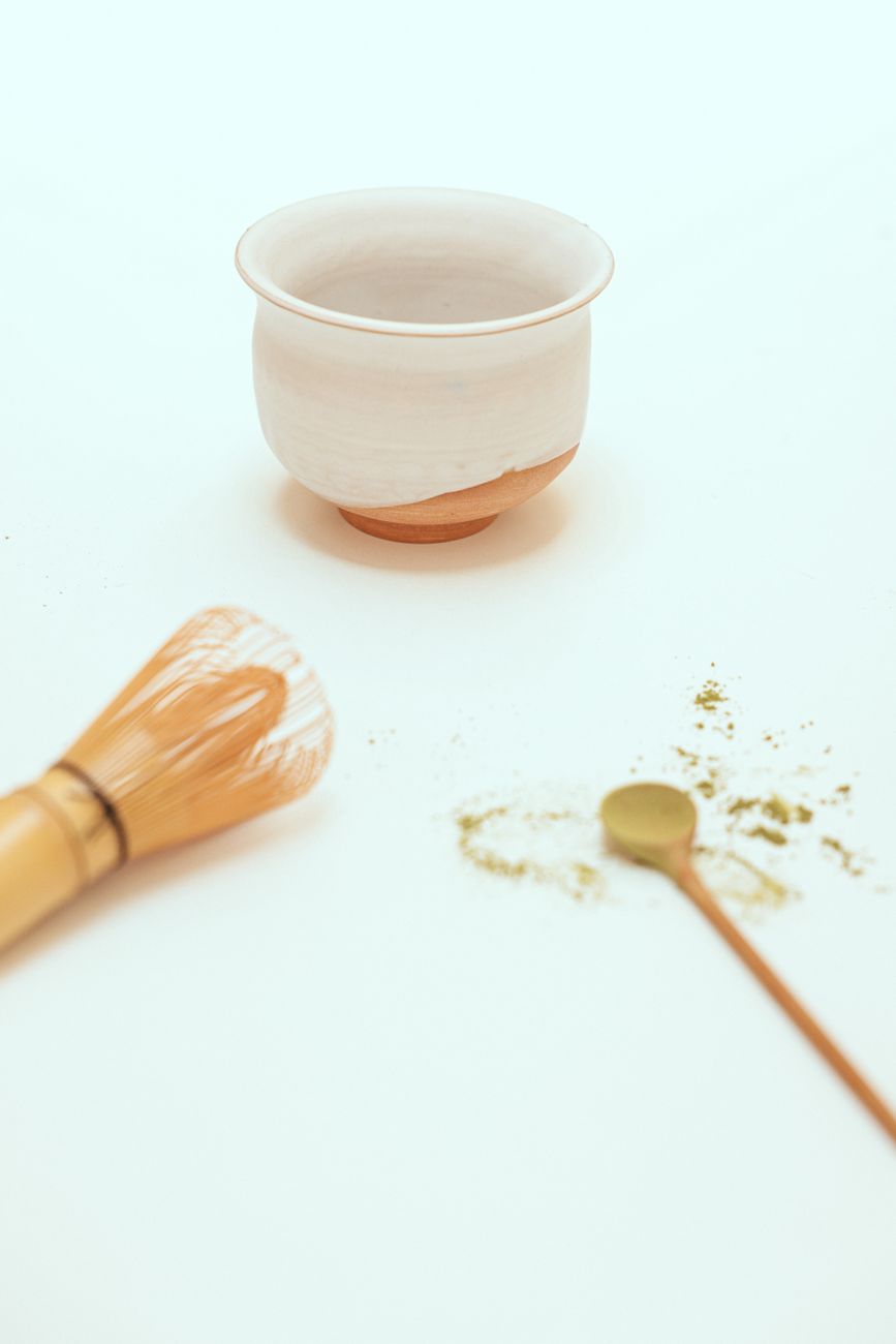 Traditional Japanese matcha tea bowl with bamboo whisk